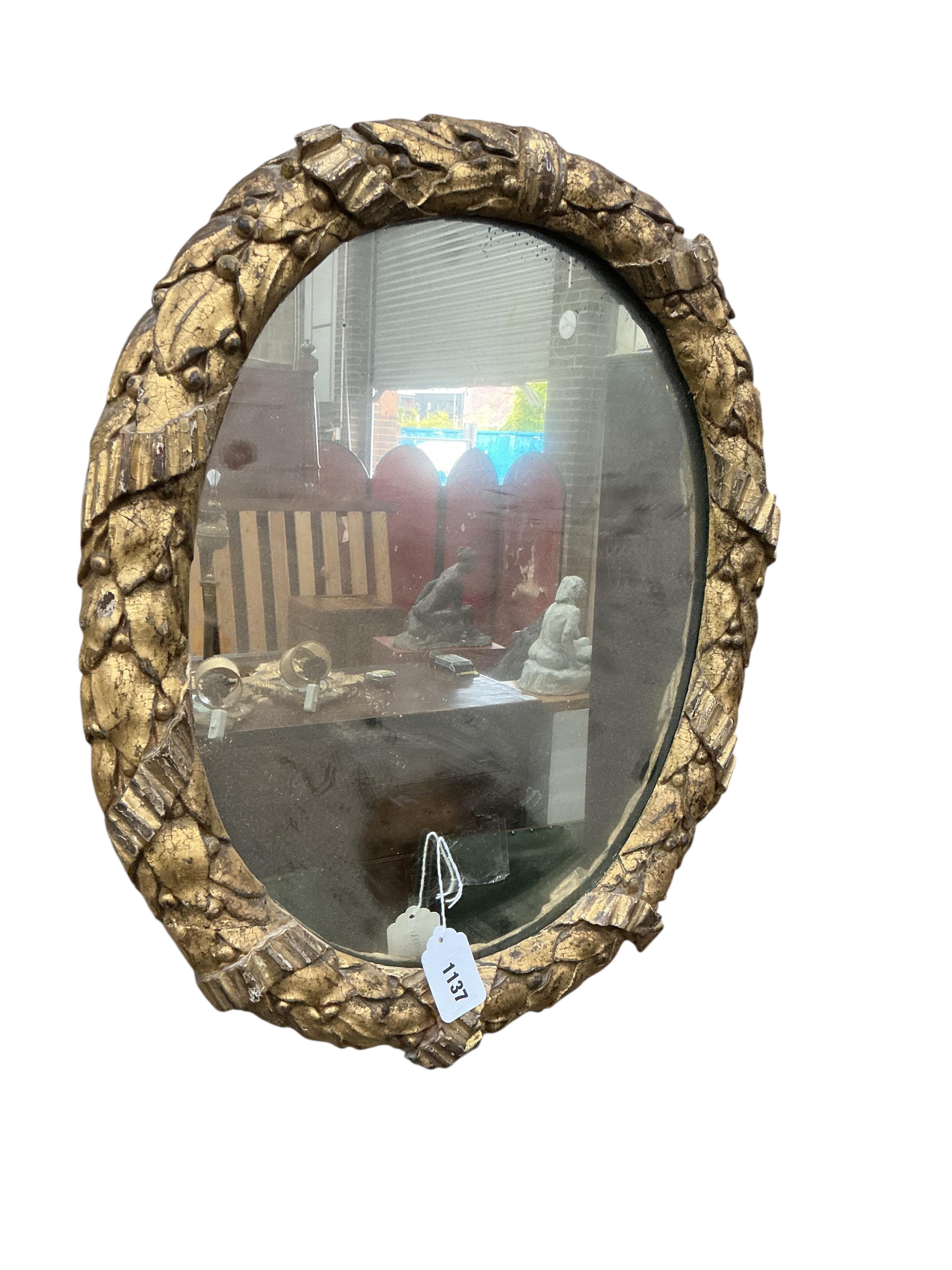 A Victorian oval giltwood and composition wall mirror, width 48cm, height 58cm